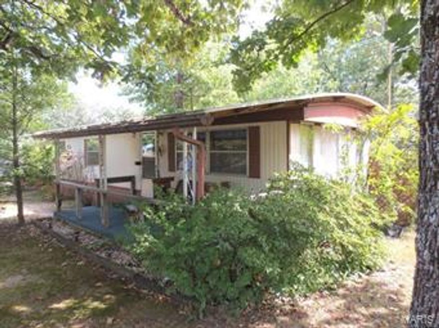 Location - Location! Just 4-miles to Bennett Spring!  You could be fishing in minutes!  This well maintained single-wide mobile home features 2-bedrooms and has many updates; such as a 10x18 add on large utility room, a detached 32x24 garage/workshop, a metal roof, Central Heat & Air, appliances, all quietly sitting on over 1-acre of land!