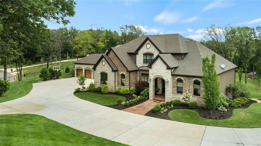 Exquisite gated home on 3.09 +/- ac & built in 2016, has a gated circle drive & 6 car garage. Home feat main floor master suite w/2 closets, double vanities, huge shower w/dual shower heads. Kitchen w/stainless appliances, gas range/oven, built-in microwave, wall oven, wine fridge, no touch faucet, HUGE center island, slate flooring & hearth room. Living room w/built-in shelving & wood floors has sliding doors to outdoor covered porch. Upper level has 4 large bedrooms and 2 full baths. The finished walkout lower level features a large rec room and bar, batting cages, full bath and plenty of room for storage. The crowning gem of this house is the backyard oasis, featuring a large saltwater pool, hot tub, covered cabana/ bar area with tin walls and wooden ceiling, with grill, gas cooktop, storage, & TV's. The entire yard is serviced by the water sprinkler. 3 zoned HVAC units, continuous tankless hot water heater, full security system & lights, 11 TV'S stay with the home and 5 fireplaces. Additional Rooms: Mud Room