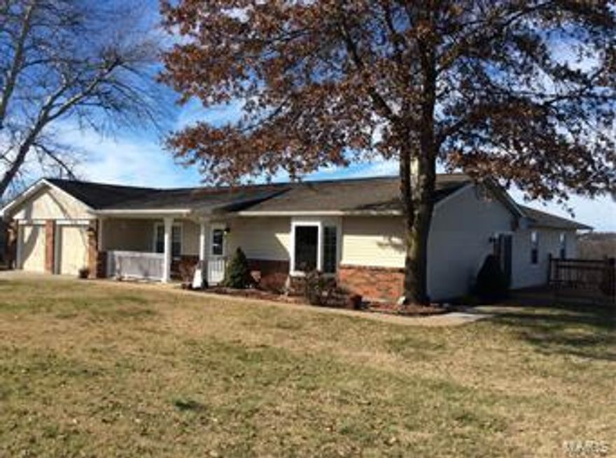 Country quiet, city close! Enjoy the peace, privacy, views, stars at night and fewer restriction of living in the country while only minutes from town. You'll enjoy all the awesome updates, from the beautiful kitchen boasting travertine tile and soapstone counters, updated appliances, totally updated bathrooms, newer flooring, stylishly painted walls and new deck. Family room could easily be used as a mother in laws suite to make this a 5 bedroom home. Enjoy your time on a private deck or in your yard; a great place to relax and get in touch with nature. 50 x 40 barn, with electric and water, welcomes horses, campers or your favorite hobby. Property is not part of the subdivision and need not comply to the subdivision restrictions. However, seller does pay for road maintenance. Property is located at the end of Fairfield Lane making it very private. Please respect seller's privacy by making appointments to view rather than turning around in property.