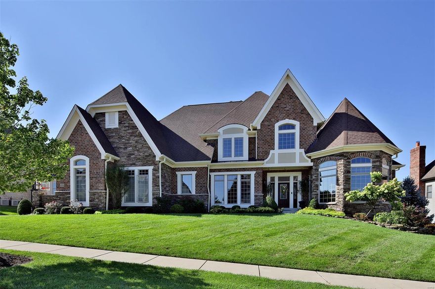 This European-styled 1.5-sty Estate home features over 7500 sq ft of living space enhanced by elaborate millwork, 10' ceilings, custom built-ins & wide plank oak flooring! Dramatic 2-sty foyer leads to library-paneled study with wall of bookcases, formal dining room & spectacular great room with 12’ ceiling & bank of windows. Designer kitchen with custom cabinetry, commercial grade appliances, butler’s pantry & 14’ center island adjoins light-filled breakfast room with built-in sideboard and vaulted hearth room with floor-to-ceiling stacked stone fireplace. Coffered master bedroom suite with huge walk-in closet & luxury bath with jetted tub provides an appealing retreat. Front & rear staircases access 4 additional bedrooms, 2 with ensuite baths & 2 with Jack n’ Jill bath, plus bonus loft room. Lower Level includes recreation room with fireplace, media room, workout room & guest suite. Atrium doors open to outdoor entertaining area with deck, screened porch with brick fireplace & patio.