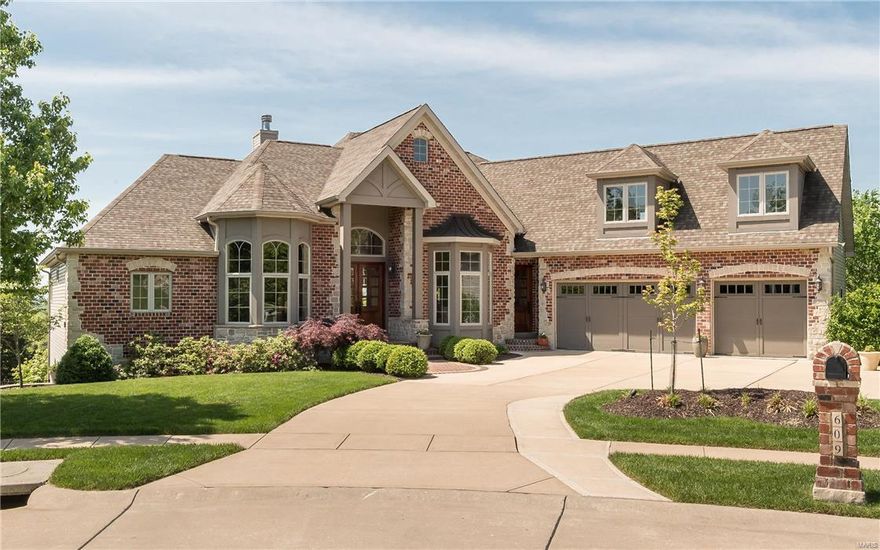 Spectacular brick & stone 1.5 Sty! Over 7000 sf of living space enhanced by gleaming wood floors, extensive millwork, 11' ceilings & walls of windows with unsurpassed views. Dramatic barrel-vaulted foyer leads to private study, elegant dining room with architectural columns & spacious great room highlighted by stone fireplace.  Designer kitchen with granite countertops, custom cabinetry, professional quality appliances & 8 center island adjoins light-filled breakfast room & coffered hearth room with floor-to -ceiling stone fireplace Sumptuous master bedroom suite with wide bay window & lavish bath w/shower spa offers an appealing retreat. Broad atrium staircase leads to 3 additional bedrooms, 1 with ensuite bath & 2 with Jack n' Jill bath, plus recreation room w/fireplace & wet bar. Additional apartment w/private entrance & elevator access (all 3 fls) features great room, kitchen, bedroom, full bath & laundry. Situated on premium cul-de-sac lot with deck, pool, hot tub & 3-car garage.