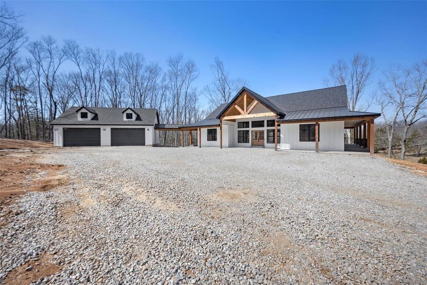 Welcome to your oasis nestled on 10 sprawling acres of pristine countryside. This custom-built 4-bedroom, 4-bathroom ranch offers a harmonious blend of luxury, comfort, and natural beauty. As you approach the property, a tree-lined driveway leads you to the charming facade with exposed cedar beams and a welcoming wrapped around porch. Step inside to discover an open-concept floor plan, where expansive windows invite abundant natural light and panoramic views. The heart of the home is the gourmet kitchen, featuring high-end appliances, granite countertops, and a center island perfect for culinary adventures and entertaining guests. Retreat to the spacious master suite with its spa-like ensuite bath. Each additional bedroom boasts an ensuite bath or jack and jill ensuring privacy and comfort for family and guests. With its unmatched combination of luxury living and natural splendor, this custom ranch estate offers a rare opportunity to embrace the quintessential country lifestyle. Additional Rooms: Mud Room