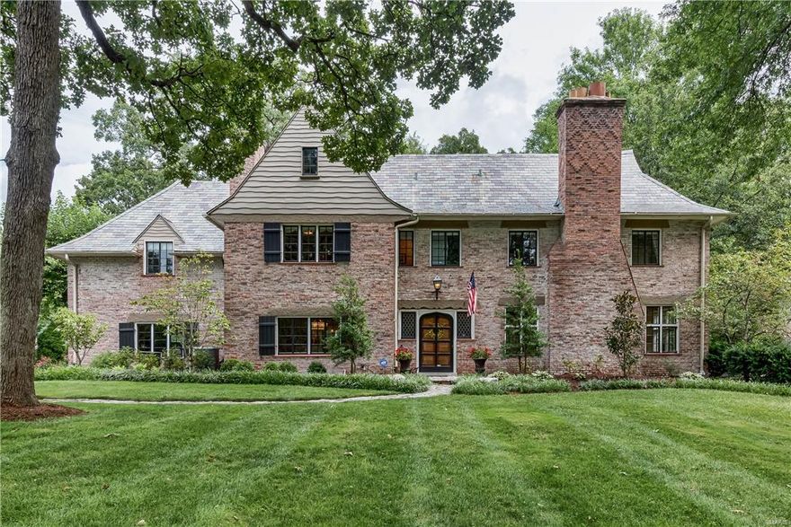 Charming & romantic, this home appears to be plucked from the English countryside & planted on its picturesque lawn with mature trees. 67 Fair Oaks embodies the classic features of timeless architecture complemented with modern touches creating an ambiance of sophisticated comfort & relaxation. An elegant staircase hangs in the entry with arched doorways leads to the formal dining & living areas. The center of activity is found in the open gourmet kitchen featuring custom cabinetry, Viking appliances & island. The space accommodates a breakfast area that opens to a large & light-filled family room.  French doors & windows provide views of the expansive yard, patio & pond. Upstairs find rooms with whimsical sloping ceilings & dormers that provide wonderful nooks & crannies. The master suite includes a luxurious master bath with a soaker tub, separate shower, custom closets & private laundry. Move right into this unique & luxurious home in one of St. Louis' most desirable neighborhoods.