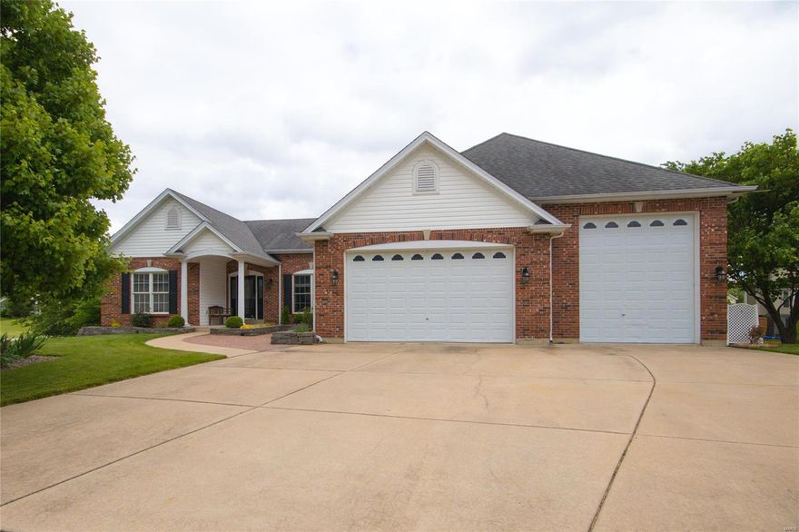 Sitting pretty on the tip of a culdesac is this better than brand new sprawling ranch with finished W/O LL. This home has been lovingly updated inside & out and is move-in ready. With this garage, you can stop paying for storage of your boat or RV, the 3rd bay is 16 wide by 40 deep with a 12ft overhead door. Inside the front door, you feel the pride this owner has taken during remodeling with warm neutral tones in hardwood flooring and paint colors. This open airy floorplan features tons of natural light and a cathedral ceiling spans all the way from the entry foyer, dining rm, great rm, kitchen, and breakfast rm. The kitchen offers lots of 42 in cabinets, granite countertops, top of the line SS appliances and a pantry too. The breakfast rm walks out to a newer 12x12 maintenance free deck and backyard oasis featuring lush landscape and dry creek bed. This home boasts 2 master bedrooms, one with a private bath. LL fam rm w/custom wet bar, 4th bedroom, bath. Builtin Ext storage room too