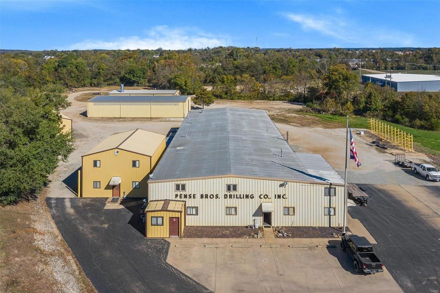 Commercial Industrial oppertunity!  Former, Pense Brotheres Drilling headquarters features approximatly 5280 sq. ft. office space and 18,800sg. ft. of shop space between 5 buildings on 12.43 fenced acres. This expansive property hosts 6 bay shop with two heated, drive through wash bays. 50x100 drive through warehouse. 3200 sq. ft. commercial paint shop with 80' drive through bay, 20x60 paint booth and mixing room. 30x50 3 bay shop and 30x70 block building. An expansive yard for storage/parking and many other features too numerous to list. The property would lend itseft well to most any growing industria/service operation with a need to store, service and repair equipment and has pleanty of office space for support or training. Does this sound like something your company needs part of but not all? No problem, the way this property is layed out it would lend itself well to leasing part out to create a revenue stream while leaving the door open for future expansion. Owner may divide. Location: City, Industrial Park