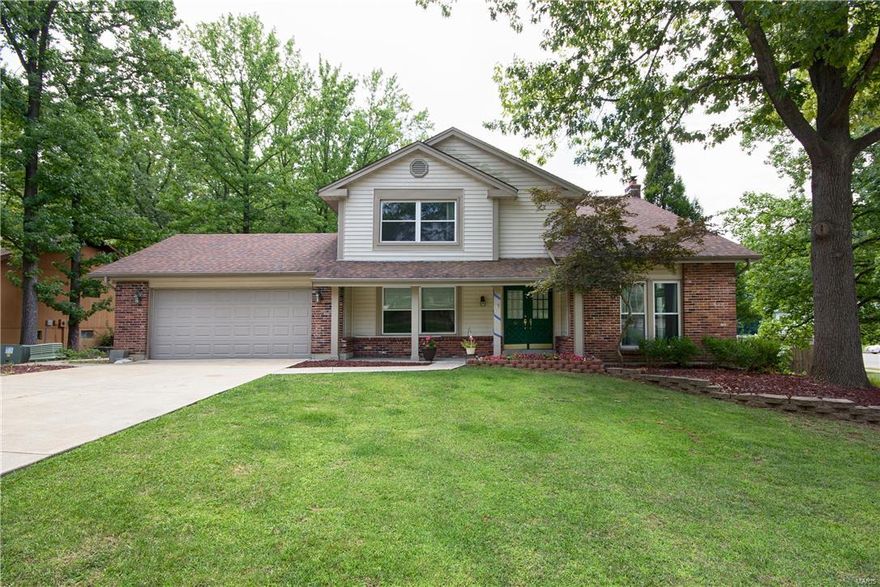 Nothing small about this home- 2,800 sq ft 2 story home, with oversize 2 car garage located on .57 acre fenced in lot, backs to trees & convenient location close to Page/364 extension. As you enter the home,you will find a large living rm w/ vaulted ceiling & spacious dining rm w/ crown molding & large windows for the natural light. The main floor has a family rm w/ wet bar & fireplace, a large rec rm w/ built in cabinetry & a spacious eat in kitchen & 1/2 bath. Main floor laundry room & w/d hook ups in basement. Upstairs the master suite has his & her closets & bath. On the second floor, you will find 3 additional bedrooms and another full bath. Lower level is unfinished but awaits tremendous possibilities with a rough-in for a 4th bath,an additional laundry hook up with a walk out. Enjoy entertaining family & friends this fall in the fenced backyard that backs to trees.  Seller is motivated & willing to pay some closing costs. Schedule your showing today!