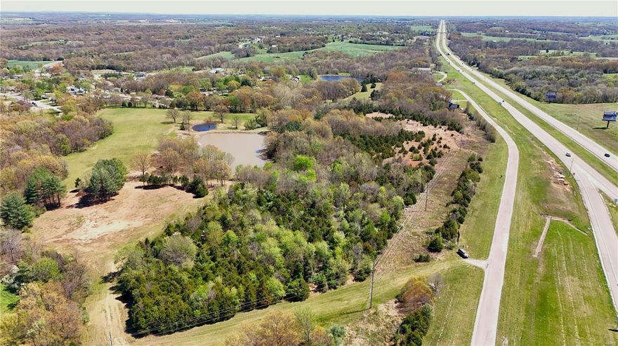 Great laying property located just off Highway 55 with highway visibility, land lays incredibly flat and is zoned C-2 which offers a wide variety of uses, from a restaurant, hotel, Apartments, and far to many more to list. Under the C-2 zoning the C-1 is also in play with many other types of uses. There is already a water easement in place on the South end of the property and a couple of options to bring in sewer. There is a small cut out of the property with 2 billboards that is not part of the property, but does have a smaller billboard sold with the property. If you are looking to expand an existing business or a new start up company this is a great opportunity in a fast growing area. Location: City, High Traffic, Hwy/Interstate Frntg