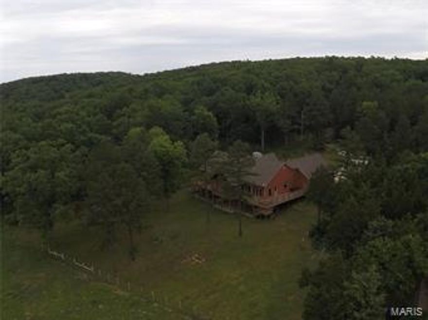 YOU MUST SEE THIS ONE OF A KIND PROPERTY!!! Property includes 216 acres with 90 acres of pasture including 30 acres of quality bottom land for hay or crops. Water supply to 9 paddocks by cattle waterers and freeze proof hydrants, covered working pens, entire farm newly fenced. This property also includes 3 ponds, a spring, borders Clear Creek and has abundance of wildlife for some GREAT HUNTING!! The beautiful custom home was built in 2012 with 2x6 walls offers 3 bedrooms and 2 baths on the main floor. The outside has Hardy cedar fiber cement siding, a wrap around composite deck for some stunning views, and an outside wood burning furnace. Walk in to living room with beautiful hardwood floors, a huge gas fireplace with mantle and vaulted beam ceilings. The custom kitchen boasts solid surface countertops, double oven, and propane cooktop in center island. Master has en suite with a custom shower equipped with body sprayers. Come take a look at this magnificent place today!
