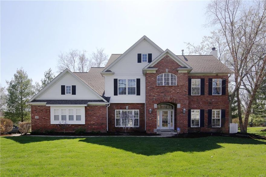 New Price! This expansive & gracious 2 story home has all the amenities today's buyer is seeking. Gourmet kitchen w butlers pantry, planning desk, granite counters, center island w seating & stainless steel appliances opens to the family rm w gas fireplace and built in bookcases. Bay window expand the kitchen eating area & overlooks the private, fully fenced, backyard. Formal living rm/study has french drs, arched doorways and easily flows from the entry and family rm.  Wainscoting & extensive millwork can be found in the dining rm & study.  Beautiful hardwood floors & 9 ft ceilings are found throughout the 1st & 2nd flrs. Take your pick of two master suites both w a luxury bath- double vanity, separate jet tub & over sized shower, and a walk in closet.  Two additional bedrms (one ensuite) complete the 2nd flr.  The media rm in the lower level has stadium seating. Fitness rm w mirrored walls, additional sleeping area, full bath, playroom & storage area.  3 car garage w epoxy floor.