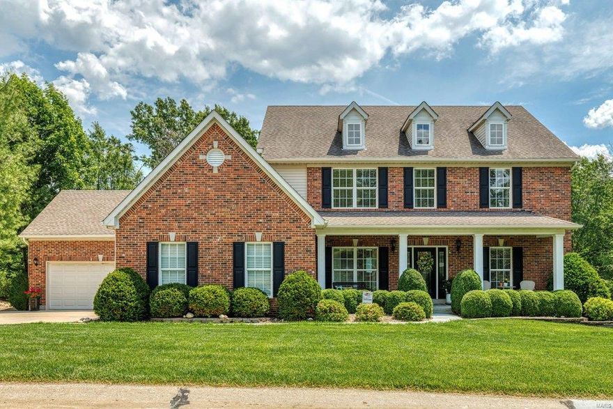 Light-filled brick 1.5 Sty in desirable Heritage Landing. Open floor plan features upgraded finishes & amenities throughout including oak flooring, soaring ceilings & detailed trim work. Covered porch entrance with leaded glass front door leads to impressive foyer, formal dining room framed by wide entryways & spectacular 2-sty great room with marble fireplace & wall of windows with private wooded views. Designer kitchen with 42” white cabinetry, granite countertops, stainless steel appliances & 9’ peninsula adjoins breakfast room with bay window & atrium door to patio. Coffered master bedroom suite with customized closets & luxury bath with jetted tub offers an appealing retreat. The 2nd floor extends the living quarters with 3 additional bedrooms, 1 with ensuite bath & 2 with Jack n’ Jill bath. Walk-out Lower Level includes recreation room, family room with built-in bookcases, workout room, 5th bedroom & full bath. Extensively landscaped .75-acre lot with pool, patio & 4-car garage.