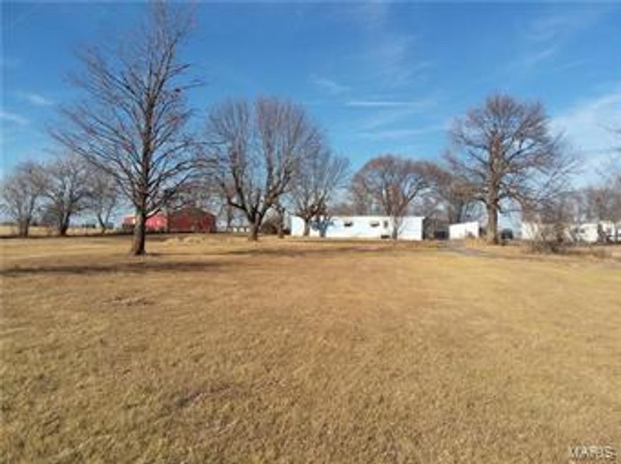 2 bed 2 bath mobile home on 1.3 acres with black top frontage. Close to Mark Twain Lake and the golf course. Single wide is in need of repair, but could be used as a hunting weekend place, fixed up for a rental or could be moved out and install a new dwelling or manufactured home. Great location to town and the lake!