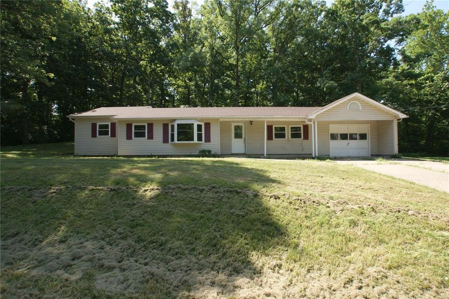INVESTOR GUT REHAB OPPORTUNITY OPEN FLOOR PLAN RANCH ON OVER 1/2 ACRE LOT (.63 ACRE) located in unincorporated St. Charles County and desirable Francis Howell Schools. 4 Bedrooms, 1 Bath, 1 Car Garage and extra long driveway for additional parking. Updates include:  newer windows 2014, furnace/air conditioner 2013, roof 2013, fence 2014. Exterior features vinyl siding, covered front porch and large partially fenced treed yard. COUNTRY SETTING with public water and public sewer but just minutes to highways, shopping, Katy Trail and schools. Rehab opportunity to have home surrounded by nature not neighbors.  HOME SOLD AS IS WITH SELLER TO MAKE NO REPAIRS OR INSPECTIONS.