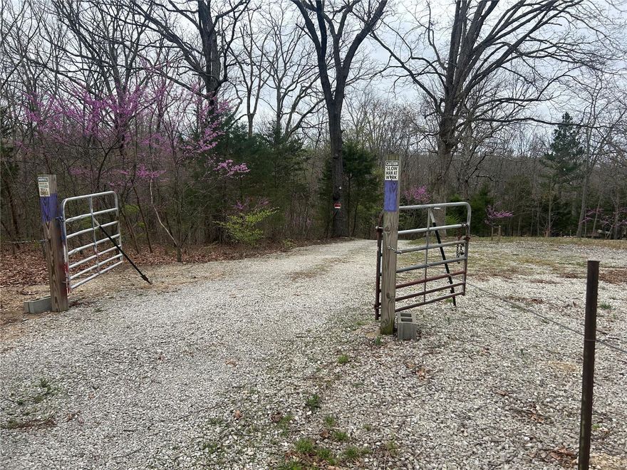 Here is your opportunity to acquire 12 acres of land in a beautiful and peaceful setting. Whether you are looking for a recreational retreat or the perfect spot for your new home, or possibly considering subdividing the land into parcels for sale, this piece of property already has Electric, Water, and Sewer.  The well head has been replaced in recent years also.  This property has 1200 feet of Hwy 47 road frontage and also can be accessed by going down Soaring Hawk Trail which is the back side of the property. The property also has 1 acre across Soaring Hawk Trail. You are able to access the front and back of property by road. 
Make your appointment today. The gate is locked and an appointment is needed to view.