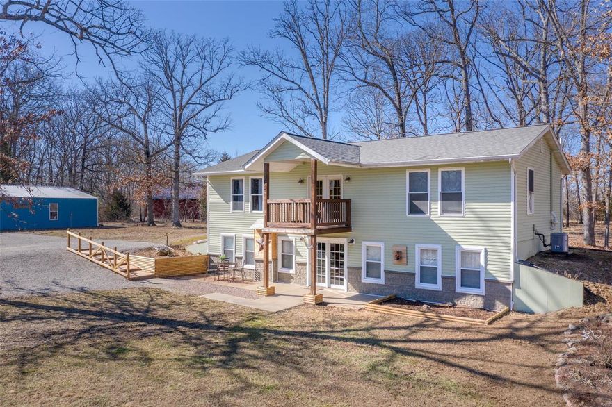 Welcome Home! Country Living at it's best! This beautiful home is situated on 3 GORGEOUS Acres backing to trees PLUS Large Pond providing picturesque views. Step inside to find large spacious Great rm/Kitchen/Dining rm combo that has been completely remodeled w/stunning Luxury Vinyl Plank Flooring. Kitchen boasts Stainless steel appliances, New counter tops & Butcher block top at center island. Full bath on Main Level has been completely remodeled. Lg Bedroom, Mn Floor Laundry, Flex Room PLUS Office provide plenty of space to Enjoy on main level. Upstairs you will find a spacious family room w/vaulted ceiling & stunning view overlooking the pond w/doors leading to deck at both front & back of home. Large Master Bedroom Suite w/recently updated Bath. 2 Additional spacious bedrooms with newer carpeting.  Lg Outbuilding 40X30 w/workshop area. 7 Acre Subd. Lake. Home has been completely remodeled inside & out w/attention to detail. This is a MUST SEE!