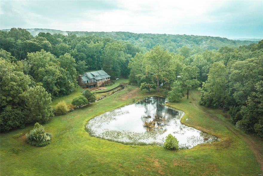This haven offers an unparalleled sense of escape & tranquility. From artesian wells to spring-fed creeks that meander throughout to the pond fed by a crystal-clear spring. The property's layout ensures an optimal arrangement, sizable 7-ac lake teems w/bass, bluegill, & catfish, providing a haven for anglers. Those seeking rustic charm, there's an extensively restored 1930s log cabin. The carefully curated dwellings on the property are plumbed w/spring water. This haven is an equestrian & agricultural dream, w/expansive pastures w/luscious grasses. Black bears, mountain lions, whitetail deer & tom turkeys call this home. Close proximity to the offerings of Mark Twain Natl Forest & MDC sites ensures that every day brings an adventure. This recreational rich area is close to Huzzah, Courtois, & Meramec Rivers for endless kayaking and canoeing, not to mention gigantic, small and large mouth bass galore. You're only mins away from Maramec Springs Trout Hatchery & the well-known Ozark Trail