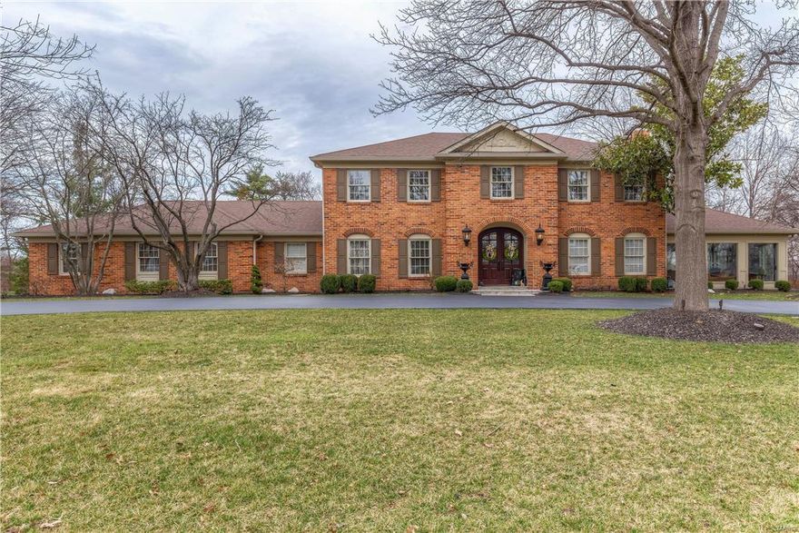 Stately brick 2-Sty in premier location! Custom-built home distinguished by exceptional craftsmanship & designer inspired renovations throughout! Gracious hardwood foyer leads to elegant dining room, family room with wide bay window, fireplace & built-in bookcases & formal living room with marble fireplace & atrium doors to step-down sunroom with coffered ceiling & 3 walls of windows. Spacious open kitchen featuring custom maple cabinetry, Corian countertops, premium appliances, granite center island & butler’s pantry adjoins breakfast room with tray ceiling & built-in sideboard and vaulted solarium. Sumptuous master bedroom suite with entertainment center, fireplace & lavish master bath offers a relaxing retreat. 3 Large additional bedrooms & hall full bath complete the 2nd floor living quarters. Professionally finished Lower Level with huge recreation room, game room & full bath. Impeccable 1+ ac grounds include patio, pool, pool house, fireplace, circular drive & 3-car garage. Additional Rooms: Sun Room