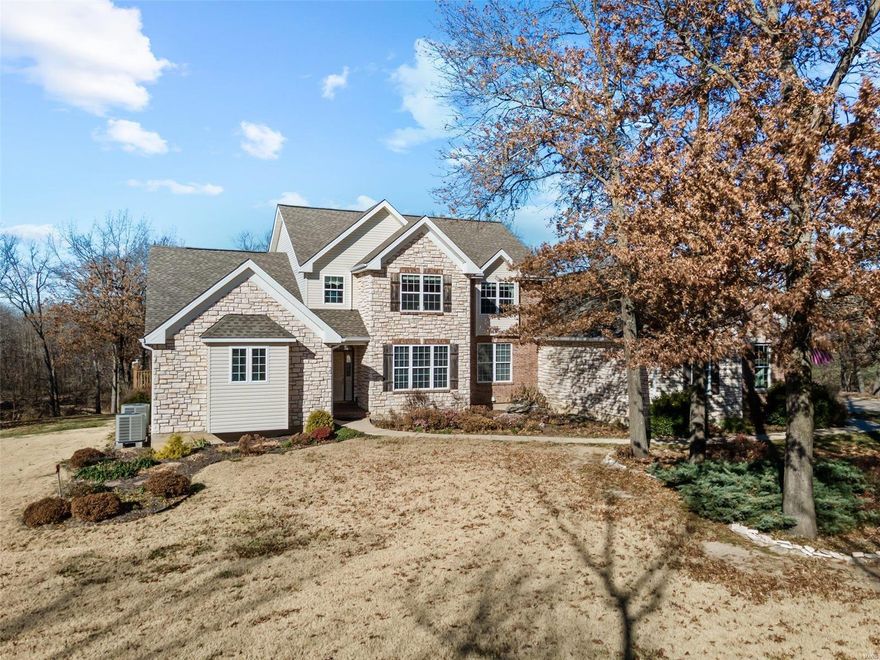 Private Paradise! Exquisite Lakefront Home on 3.29 acres! Walk into a Grand Entrance w/beautiful maintenance free Slate Flooring & magnificent wall of windows view. Kitchen has SS appliances, Dble Oven, Gas Cooktop, Granite Countertops & Backsplash, Ctr Island/Brkfst Bar, 42” Custom Cabs & Walk-in Pantry. Through the kitchen is a Serene Hearth Room w/built-in bookcases & WB Fplce w/French Doors leading to the All Season Rm. Mn Flr Mstr Ste has His&Her Walk-in Closets, huge Bay Window & French Doors out to a covered deck. Mstr Bth has Italian Porcelain Flooring, jetted tub & Sep Shwr. Formal Dining, Laundry, & ½ Bth complete Main Floor. UL has 3 bdrms w/2 sharing a Jack N Jill bth, & 1 with it’s own suite. An expansive Walk-Out LL has large Rec Room w/Bar, Media Rm, 5th Bdrm, Exercise Rm, Office, & Screened In Porch. Backyard is perfect for a Pool addition with room for add'l outbldg and/or Barn. Horses Welcome. A very Private Setting, yet minutes from Hwy. 64/Lake STL area. Additional Rooms: Sun Room