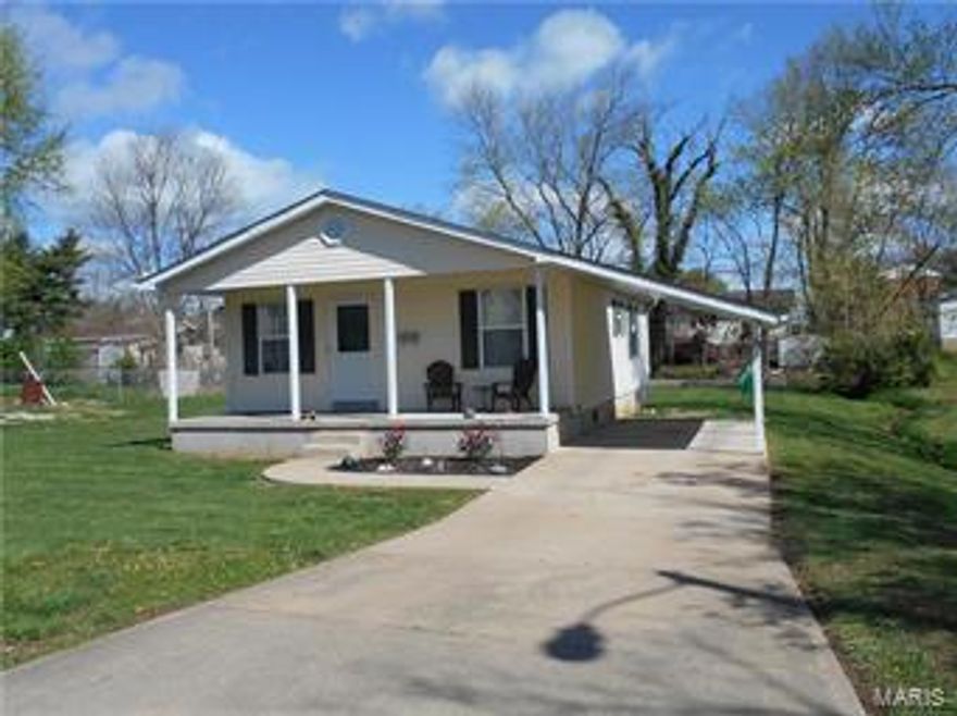 Marvelous opportunity to own this cute as a button home that has been gloriously brought into Y2016 with such modern features as granite vanity top, stainless appliances including convection oven, NEW HEAT PUMP, new LED lighting and upgraded ceiling fans, new carpet and luxury vinyl in kitchen, bath and entry. This home is only blocks away from school and shopping and has the comforting sounds of a babbling brook that separates the neighbors.  Enjoy a little piece of luxury all wrapped up in an affordable price!