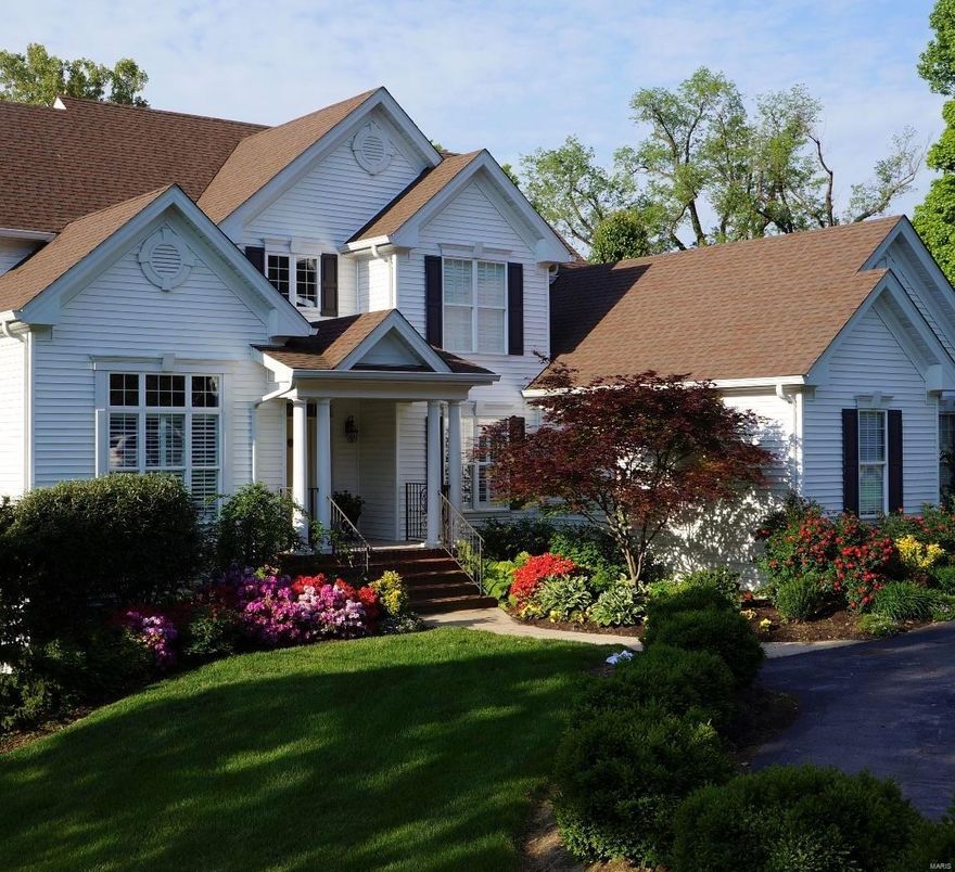 Nestled on a wooded .43-acre lot, this meticulously maintained 1.5-sty home offers 5,400SF of living space spread across 3 levels. Highlights include wood floors, a main floor primary suite with custom closets and spa-like bath, and a study w/built-in bookcases. Attention to detail is evident w/luxury millwork, crown molding, recessed lights, & elegant white wood blinds. Cozy up by the gas fireplace in the great room or the vaulted hearth room. The kitchen is a chef's dream w/granite countertops, custom cabinets, top-of-the-line appliances, a butler's pantry w/icemaker, & breakfast room w/a bay window & window seat. The main floor laundry offers built-in storage & cubbies. Upstairs you'll find 3 BDs, 2 bathrooms, & a bonus room. The LL is an entertainment haven, w/spacious rec room w/brick paver floor, playroom, & large unfinished storage area. Outdoors find a low-maintenance deck and a paver patio. Also a security system, zoned heating & cooling, central vacuum, & sprinkler system.