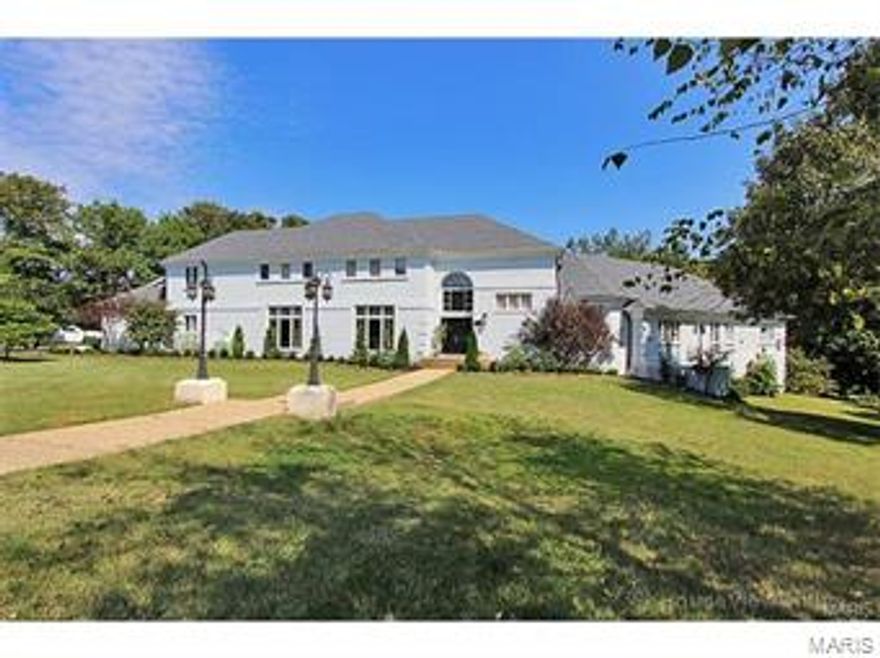 Outstanding, one of a kind luxury home with unbelievable space and privacy.  This is a 7 bedroom, 7 1/2 bath home with a huge new theater room and new outdoor covered sitting veranda with fireplace, TV, and kitchenette.  There is a new Gunite, heated pool with auto cover that overlooks a gorgeous lake.  This sits on 1.55 acres at the end of a quiet cul-de-sac and has a 4 car garage.  This is a true must see home!!!