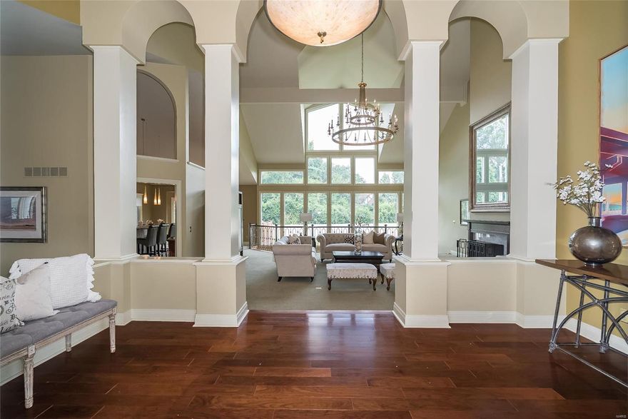 Spectacular ranch style home located in prestigious Creve Coeur! Open floor plan features distinctive design throughout including soaring ceilings, expansive windows & custom built-ins. Impressive Brazillian Cherry Hardwood foyer highlighted by architectural columns leads to stunning great room w/dimensional ceiling & dramatic wall of windows. Designer kitchen w/42" cherry wood cabinetry, granite countertops, premium appliances built in, walk in pantry, under counter lighting which adjoins breakfast room w/vaulted ceiling & newer sliding door to composite private deck. Master bedroom suite with gorgeous vaulted ceiling & stairway to private sitting area, plus a 2nd bedroom, full bath & a study/office complete the main floor living area. Gorgeous atrium staircase leads to W/O Lower Level w/frpl. family rm. game rm. rec. rm. 2 more bedrooms or workout rm. all on 1 acre cul de sac lot w/patio OVERSIZED 3CAR REAR ENTRY GARAGE