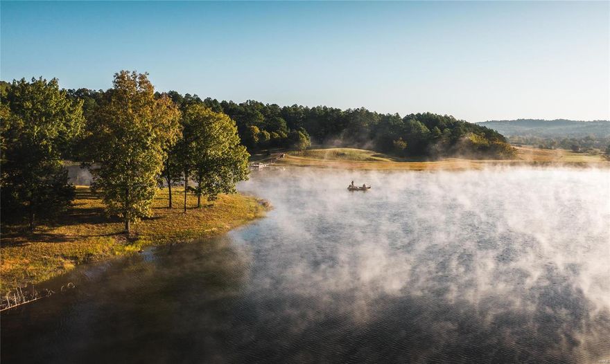 Stepping onto Laura Lake Farm is like jumping a few states and opening the door to a tall pines lake meadow far out West. Laura Lake Farm is comprised of 273.9 surveyed acres in Shannon County MO, just South of Eminence. The gorgeous 1300 sq ft 2 bed, 2 bath home overlooks the 17 acre spring fed lake stocked with bass, crappie, catfish, walleye, northern pike and tiger musky. This isn’t no joke folks, some of the pike have grown to over 40” long and continues to be seen. 115 acres of pasture are fenced, crossed fenced, and are cattle ready. Heavy-duty metal corral and catch complete the livestock necessities. Outbuildings include a 48x32 heated shop with two overhead doors and 28x20 heated work shop addition, 60x30 equipment shed and 80x40 hay barn. Very seldom will you find a property of this caliber offering all the luxuries of a spring fed lake, fertile pastures, and excellent hunting all surrounding a cedar lodge with one of the most breathtaking lake views you will ever witness.