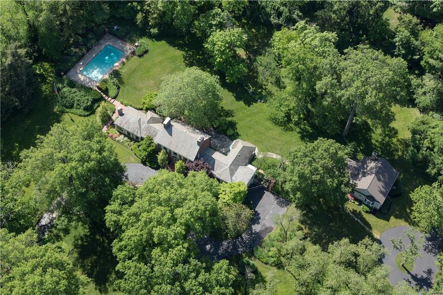 This is What You Need to Know: 5.0 acres in exclusive Huntleigh. Equestrian (steps from 20+mile Bridle Riding Trails). 1.5 Story (Main Level Master). Heated, fenced in-ground pool. 5000SF Maritz&Young all-brick Main Residence (as the homes of Clayton's Brentmoor Park and Carrswold,neighborhoods). 4BRs, 5BAs. 3 Additions have been made (Master Suite, Kitchen/Breakfast Room, Guest Cottage).  Cottage has private entry & drive (fully independent; luxury living for in-laws quarters or office/studio). Walkways, terraces & patios surround the residence. Manicured grounds, mature trees & artful landscaping. Rec Room on Lower Level.