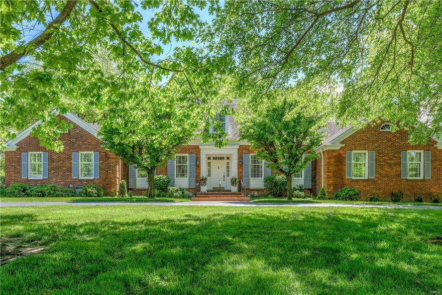 Higgenbotham-built 1.5 Sty inspired by Virginia’s Evelynton Plantation! Exceptional design features throughout including gleaming wood floors, extensive millwork & custom built-ins. Gracious hardwood foyer leads to library-paneled study with built-in bookcases, formal dining room and spacious living room with marble fireplace flanked by lighted display cabinets. The kitchen is a chef’s delight with custom maple cabinetry, center island with retractable table & butler’s pantry with wet bar. The master bedroom suite with His & Hers walk-in closets & ensuite bath provides an appealing retreat. The 2nd floor extends the living quarters with 4 large additional bedrooms (2 with Jack n’ Jill bath) & hall full bath. Professionally finished walk-out Lower Level includes family room & wet bar—perfect for casual entertaining—plus 6th bedroom & full bath. Situated on parklike 1-acre grounds with patio & 2-car garage. Within walking distance of Queeny Park, Mason Village shops & Longview Farm Park.
