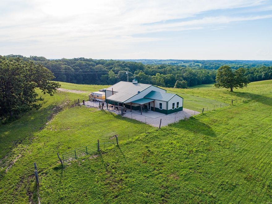 Check out this unbelievably nice cabin/house and 327 m/l acre property in a big buck country! This property would make a great residence or hunting camp.  Tracts of this size don’t show up on the market for sale very often in Adair County Missouri! This tract is located in some of the best deer habitat that North Missouri has to offer. This farm has produced a 182 inch giant!  Everything about this home is incredibly well done. The 940 sq ft. approx..  House has all metal siding and roof for low maintenance. A pretty 12x20 front porch with wood posts makes a nice place to watch the sunset. A large attached 882 sq ft. approx.. garage will hold all the toys. The heavy timber wood  interior is stunning and has a wonderful outdoor feel!   A beautifully finished home/cabin, big buck history, food plot areas, tillable make this a true turnkey property. This is the ultimate North Missouri tract in monster buck country, don’t miss out!