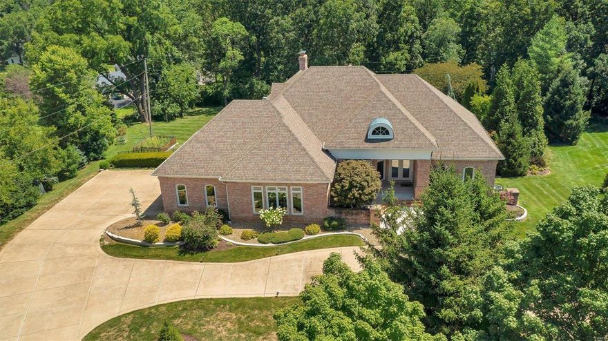 Check out this stunning, all brick ranch home in the heart of Town and Country. Over 5,000 sq ft, on two levels. Impressive entry with tall ceilings, arched doorways, crown molding, rich oak floors and fresh neutral paint. Great Room features coffered, accent ceiling and floor to ceiling wall of windows bringing the outdoors in. Chef's kitchen w/ huge breakfast bar, island, SS appliances, walk-in pantry, cozy breakfast nook, Hearth Room w/ gas fireplace & wall of windows leading to enclosed porch overlooking lush landscaping & inground pool. Luxurious Primary suite features Trey ceiling, bath w/ dual vanities, jacuzzi tub and spa-like shower plus huge walk in closet. Add MF bedroom ensuites. Two laundry rooms. LL Rec Room /media room, bar with full kitchen, exercise room and TWO separate bedroom ensuites. Incredible outdoor space with covered patio, pool surrounded by professionally landscaped lawn. 3 car oversized garage all on a prime 1-acre lot! This is luxury living at its best!! Additional Rooms: Mud Room, Sun Room