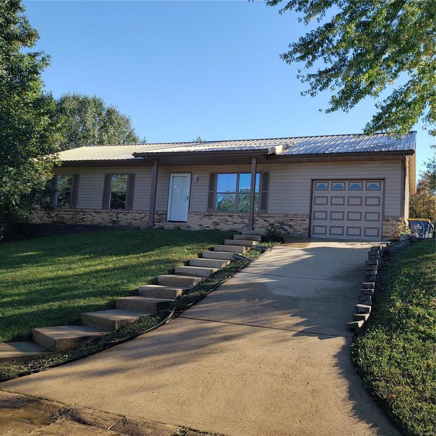 Just a few more items to do to complete this major interior renovation of this three bed full basement home. New carpet, new ceramic 18" tile, new two tone paint theme with chair rail, sliding patio door, FOREVER METAL ROOF!, bathroom waiting for your choice of color scheme. Rough in bath in lower level. USDA approved.