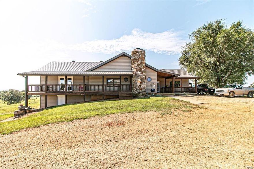 Farms like this are hard to find!  Hunting Paradise - lots of wildlife!  Large home with basement overlooks this beautiful, breath-taking farm.  The property is private & secluded, but only 12 miles from Doniphan.  281 acres, all fenced and cross-fenced into 12 sections with 12 ponds. Pastures include bermuda grass, bluestem, fescue, orchard and clover.  Property includes a hay barn (100x40), holds 500 round bales, equipment shed with 3 large bays (36x48), large workshop/tool shed 3 bay (80x36) with lean-to, corral, plus an additional large wooden hay barn.  Home is large & spacious, open floor plan, beautiful rock wood-burning fireplace in living room.  Basement not only comes with additional sleeping quarters, but has a rec room, kitchenette, private entrance & covered porch with fire pit. Lots of storage and much more!  Home includes 2 separate rooms with private entrances that would be perfect for guests. *Sq. footage includes basement with 2100 m/l sq. ft.