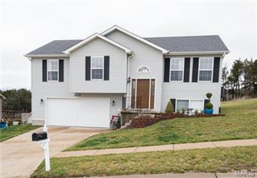 Lovely well maintained home back on the market through no fault of the Seller.  Price reduced.  Look no further!  This home will delight you in Glenstone Estates!  Split Level offers Open Floor Plan for Easy Entertaining. Generous Room Sizes.  Divided Floor Plan.  Master Bedroom Suite is ready for your King Sized Bed, Master Bath and Large Walk In Closet. The other 2 Bedrooms share a Full Hall Bath.  The Great Room Vaulted Ceiling and natural light which opens to the Large Eat In Kitchen with generous Cabinets and a Double Pantry.  There is a wonderful view off the deck.  New Laminate flooring in Kitchen, Foyer and Bathrooms. This has been well maintained by original owner. Great Curb Appeal.  Large Over sized 2 Car Garage.  The Lower Level has plenty of storage and is looking for your finishing touches.  Newer Laminate flooring.  Newer 1,800 entry door.  Fox School District.