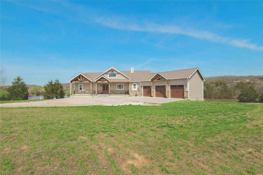 NEW PRICE! Beautiful Custom designed and built home. Home overlooks private stocked 7 acre lake with swim deck-nestled on 33.6 scenic acres!  Power Driveway Gate. Front of home Flagstone Masonry Stone-Porch posts Hemlock wood, LG Siding-3 car attached Garage. Walls  2x6 construction-Main floor is Open Concept-Wheelchair Width Hallway-Wood flooring main level-Wood Look Watertight PVC Flooring in basement-Porcelain Bathroom Flooring, 36" Oak 6 Panel Doors-Thermatru French Doors with built in blinds-Jeld-Win Windows-Granite Countertops throughout home-Kitchen - 48" Cabinets, Stainless Steel Appliances-2 Master bedrooms with full bathrooms main level-Walk in Glass Block Master Bedroom shower-2 laundrys each level-Walkout Basement-Rear Deck Composite Decking-Deck has Invisible Railing. Foundation 10' tall 12" thick, Dual HVAC Heat Pump 16 Sear system, 600 amp electrical service-2 Hot Water Heaters-Hot Water Recirculatory System-30x42 Metal out Building with Lean To.