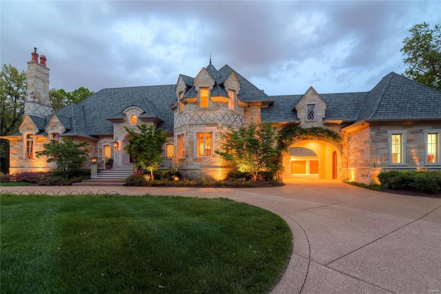 Magnificent custom built home, designed by Dick Bush, on 1.8 acres in the heart of Ladue! Wisconsin Limestone exterior w/3 levels of exquisite high-end finishes totaling 9,361 sq. ft.  The 20 ft. foyer w/gorgeous molding, archways and detail looks out to the pristine patios & pool w/rock waterfall....a backyard oasis!  Spacious gourmet chef's kitchen w/Viking and Sub-Zero appliances opens to breakfast room and amazing Hearth Room...all w/spectacular views of the outdoor living space.  Main floor Master wing w/sitting room, library/study, his & her closets & luxury bath. 4 en-suites bedrooms upstairs & newly updated lower level (wood paneled family/billiards room with bar (walks out to new lower level patio with hot tub, kids area, gym, media room, batting cage, bedroom & two baths.  Amazing!  Only the finest quality material throughout. 5 camera security system w/driveway sensor, 4+car epoxy finished garage w/porte cochere & electric hookups, circle drive & extra parking. Spectacular!