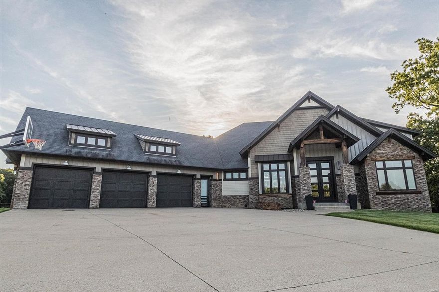 This amazing 6 bedroom 4.5 bathroom sitting on 29m/l acres has 6,300 sqft under roof that includes finished and un-finished sqft along with the basement. This home hass much to offer and is less than 2 miles from town.  Upon entry the 14.5 ft ceilings and the nearly 10ft windows gives this home an instant wow factor.  The 14.5 ft mosaic tile gas fireplace sets the living room as one of the centerpeices this home has to offer. The extra large gourmet style kitchen is sure to be one any cook will love and offers enough space for large gatherings.  This home is also on a Geo-Thermal unit for low utility bills. Other things this home offers is an extra large master bathroom with heated flooring and built in electric plugins in the drawer of the vanity, a large master closet with an island and chandelier, a slide into the basement, an amazing upstairs and downstairs outdoor entertaining area, a "Secret Safe Room", and out door gas and wood burning fireplace, and much, much, more.