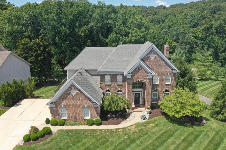 One of a kind 2 story home w/ over 5,800 sq ft of living space on a private, half acre lot backing to trees & situated on a cul de sac. Stunning  2 story entry hall that leads you to a formal dining room that shows like it just came out of a magazine. Cozy family room has a gas fireplace & large bay window. You'll love the kitchen, it's open to several other rooms for entertaining & features custom cabinetry, quartzite countertops, Monogram stainless steel appliances, a walk-in pantry, a breakfast bar, and a bar for entertaining. The hearth room is a decorator's delight w/ an incredible gas fireplace. You'll enjoy a large composite deck to overlook your sprawling yard. Upstairs you'll find more hardwood floors & four spacious bedrooms including a fantastic primary suite w/ a new bathroom. New roof, gutters, and water heaters installed August/September 2023. Additional Rooms: Mud Room