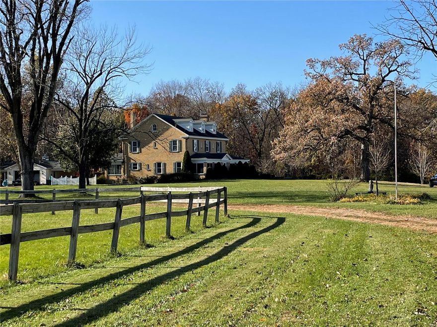 PRICE IMPROVEMENT!! Welcome to Fieldstone Farm, an exquisite 60+-acre equestrian estate set on some of Lincoln County's most sought-after acreage, overlooking the Mississippi River valley. Built in 1930, the majestic, 3-story brick home is surrounded by rolling pastures, a picturesque lake, 4-stall barn & stunning views in every direction. With 6 bedrooms & 3 baths, the home retains its historic character and is an ideal weekend retreat, horse farm, hunting lodge or full-time residence. Period moldings, stone fireplace, wrought-iron enclosed patio & two lovely glassed side-porches highlight the home. The impressive staircase leads to 5 d floor bedrooms, with the primary suite on the 3rd level. Forty+ acres of fenced pasture land are flanked by about 20 wooded acres filled with deer and turkeys and providing privacy for weekenders & hunters alike. Located off Hwy 79; just a little over an hour from St. Louis and 10 mins from downtown Elsberry, this gorgeous estate is truly remarkable. Additional Rooms: Sun Room