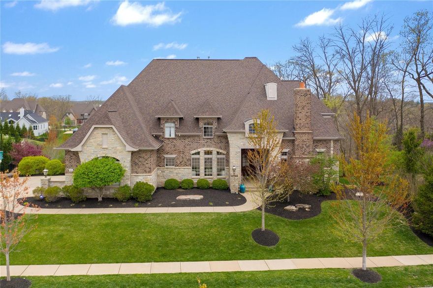 Beautiful former display home built by Simon Homes in Fox Hill Farms! Spacious and loaded with fine upgrades. Hardwood flows throughout the main living areas. Stunning woodwork including a beamed ceiling in the home office, wainscoting, crown molding and gorgeous trim. Fantastic great room with 20-ft ceiling, wet bar, floor-to-ceiling windows and a gas fireplace. Huge kitchen/hearth room with top-of-the-line appliances, large center island, custom cabinets, vaulted ceiling and opens to charming screened porch. Front/Back stair floorplan leads to three room UL BRs and two full baths. The walk-out finished lower level is one place where everyone will want to hang out. The rec room offers new carpet, fresh paint, wet bar and a fireplace. The two-level media room features surround sound, 4K projector and 100-inch screen. Don't miss the massive home gym with Nike rubber flooring and a water fountain! Sonos whole house sound system. Huge 1-acre lot provides option for future inground pool.