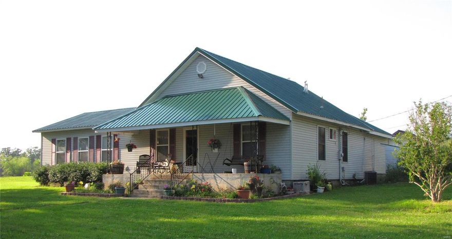 GREAT MINI-FARM- 44 Acres with a 3 acre SPRING FEED, STOCKED  LAKE. 1900 sq ft home with 3 bedrooms, 2 full baths rooms and large family room with lots of windows and beautiful views, home needs a little TLC and up dating.. Great place for horses, goats, cattle,chickens etc. Partly cleared for grazing/hay and partly in woods for hunting or just enjoying the wild life. LOTS OF DEER! Horse Barn-24x24, Pole Barn 30x50 divided  into 3 sections and several other out buildings including a workshop and a granary, (3) 4x20 covered dog runs on concrete, set up so you can add more. 2 separate fenced grass areas join dog runs. Property also has 2 wells, one for watering the animals and a new 600' well for the house. Farmington is just a little over an hour from St. Louis and this area is surrounded by several beautiful State Parks. RESTRICITIONS NO MOBIL OR MANUFACTURES HOMES- WILL BE RECORDED     
NOTE: 11.98 ac across the creek  $50,000.00    $4000.00 AT CLOSING FOR KITCHEN APPLIANCES