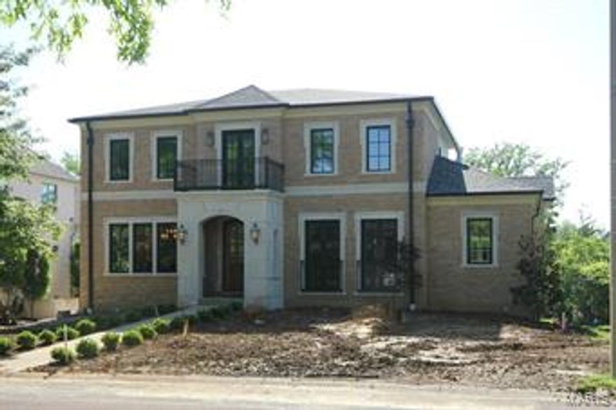 JUST COMPLETED! Magnificent 1 1/2 story 1 block north of downtown. 5 bedrooms 5 1/2 baths over 6000 square feet of living area. Formal entry. Den with fpl. dining room with tray ceiling, butler pantry with ice maker. Stunning kitchen with o/s island with danby marble & granite tops, wolf appliances, subzero refrigerator, dual wine cooler, prep sink, pantry cabinets. Super great room with stacked trim ceiling, 8' door units flank cut stone fpl. Brazilian wood deck. Huge master with 12' coffered ceiling. Stunning bath, air tub, huge shower, his & her closets. 10' ceilings & 8' doors on main. 9' ceilings & 7'doors up. 3 bedrooms with private baths & walk in closets. Huge sitting room with wood floors & coffered ceiling. Laundry room up & laundry closet on main. Beautiful lower level with 5th brm or exercise room, 5th bath, custom wet bar area with wood floors looks through to a family room with 8' w/o doors to a patio. aggregate walks & patio. Custom lighting. UNBELIEVABLE TRIM THROUGHOUT