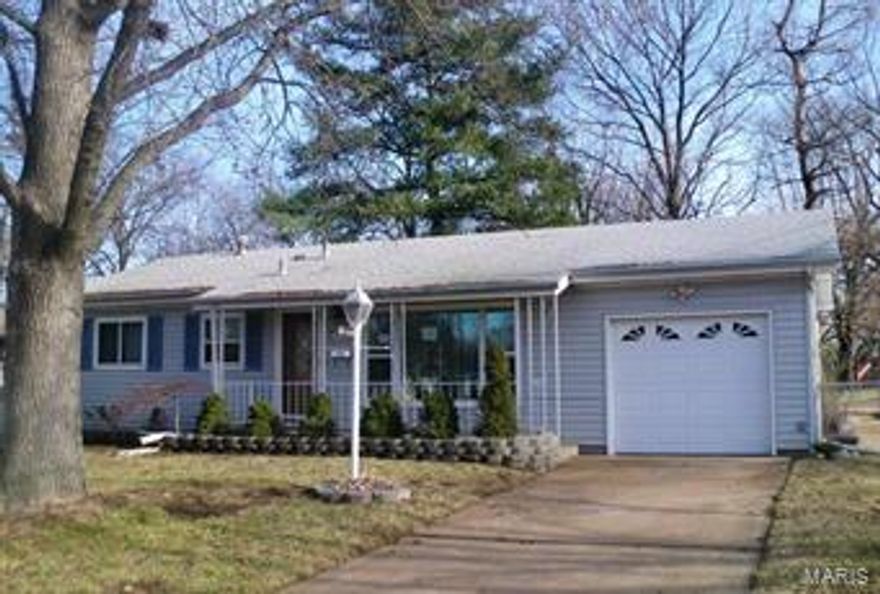 Pull up to this well kept home on a quiet street with a beautifully landscaped yard. Enter through the decorative front door which leads to a living room with big window and hardwood floor. Master bedroom has private half bathroom. Kitchen has newer ranger. refrigerator, Washer/dryer included in "as-it" condition. one car garage. newer six panel door through out.  Level fenced yard. Walking distance to the park. Hazelwood West high school. Great location, minutes away from I-270 and McDonnell Blvd. Close to many business, shopping and restaurants. Great neighborhood.