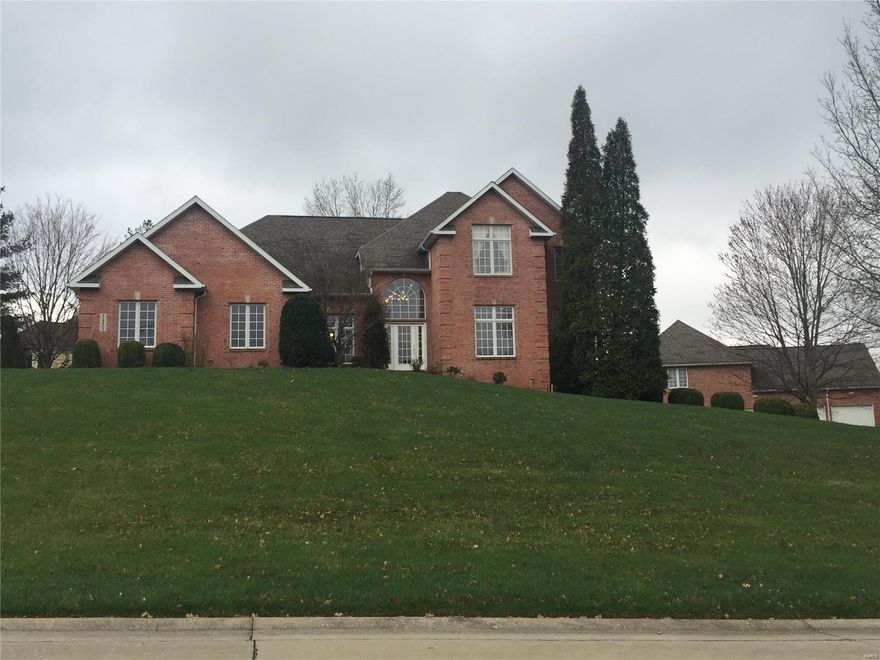 THIS COULD BE YOUR DREAM HOME! Spacious 1.5 story in a wonderful, conveniently located, Cape Girardeau neighborhood! This all-brick home is move-in ready for the next homeowner to enjoy! Amenities include hardwood flooring, custom cabinetry/woodwork, vaulted/trayed ceilings and crown moldings. The very functional kitchen with island and eat-in area includes wood flooring, granite countertops, and stainless appliances. The kitchen flows to a separate, generous dining room space, perfect for large gatherings. This home has a spacious, comfortable main level master suite with recent updates and a large main level laundry. The walk out basement is perfect for entertaining with a big family room/rec room area and a built-in bar with a wet bar, granite counters and custom cabinetry. Plenty of closet space and storage PLUS a 3 car garage too! Set up a private showing today!