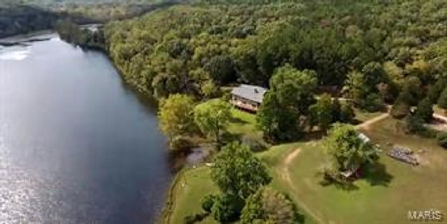 WOW!!! This home is absolutely amazing and a RARE find! This home sits on 200 ACRES m/l with a 30 ACRE m/l STOCKED LAKE!!!! This home and property is marvelous. The home has almost 3000 square feet (2854 m/l) with 3 bedrooms and 3 bathrooms. The living room has a floor to ceiling stone fireplace! Beautiful view over looking the lake from your living and formal dining room! Lots of natural lighting! Kitchen with another dining area, pantry, stainless steel appliances! The master with HUGE windows overlooking the lake! Master bathroom with large vanity, walk in shower with separate jetted tub!! The upper level has 2 more LARGE guest bedrooms and an additional bathroom! Real wood flooring! There is a green house and barn on the property. There is a back up generator that connects to the barn and the home for emergencies! TWO water heaters in the basement! The home was constructed with 2x6, giving more support and insulation!