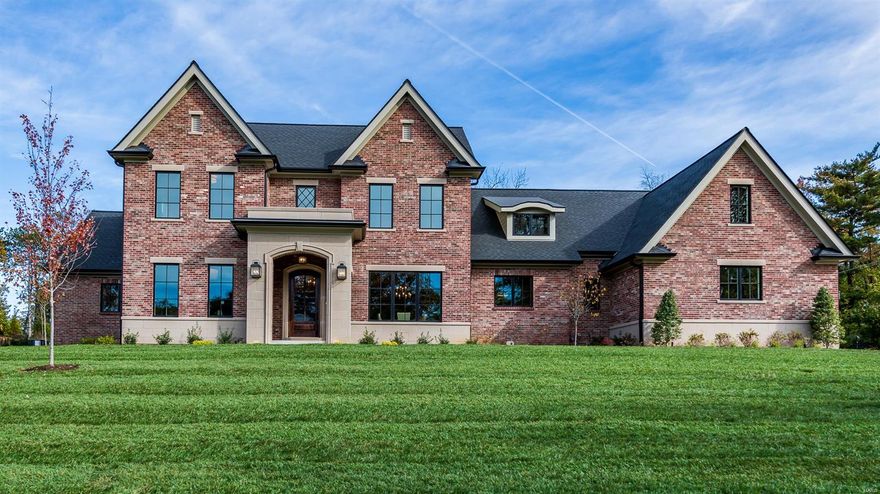 Over 4,500 SF, meticulously designed for todays lifestyle. 1.5 story brick & stone residence by Mark S Mehlman Homes sits on 1 acre in the heart of Frontenac. 4BR/4.5BA, Spacious open plan perfect for family & entertaining. Fine details abound: tray & vaulted ceilings, beautiful hardwood floors, Pella windows, 2 Frplc, custom finishes & beautiful lighting. Spectacular 1st floor master suite w lg custom designed closet. grmet kit opens to a dramatic hearth rm w/ full stone Frplc. Center Island kit w/breakfast bar plus a separate breakfast rm, Custom cabinets, stylish range hood, beautiful backsplash, Wolff/sub-zero appl. The 1st floor study is ideal for a home office. Unique 20'x12' laundry rm w custom cabinets & center Island perfect for family living. Covered rear patio leads to private backyard.  2nd FL has  3-ensuite lg bedrooms. 4-car garage fully drywalled w custom storage area . Beautiful landscaped yard w irrigation system & outdoor lighting. Great Neighborhood. Many new homes. Additional Rooms: Mud Room