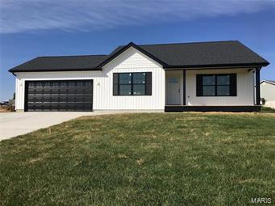 Contemporary meets craftsman in this 3 BR 2 BA home. This split bedroom floor plan has upgrades inside & out! Large 19x5 covered from porch invites you into a vaulted family rm with impressive wood beam accented with tons of recessed lighting & stained trim package, ship lap wall with electric fireplace. 42" Gray Shaker Style cabinets with soft close feature & black hardware. Stainless steel appliances include stove/range, space saver microwave, Dishwasher. Center island w/granite countertops & on trend tile backsplash. Large 20x20 custom deck to entertain & relax on. Ceiling fans in every room! Upgraded black vinyl Energy Star tilt in windows, rough-in for bathroom in the basement and an egress window as well for a future bedroom/flex space! Main Floor Laundry. Driveway & sidewalk are beautifully stained & upgraded have extra rebar. 36" of rock under your foundation and backfilled with rock - not dirt! Enjoy the Community Fishing Lake. 100% Financing is available here!