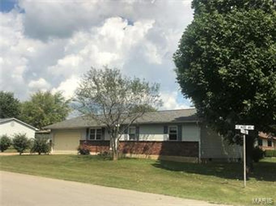 EASY LIVING ON ONE LEVEL Nice corner lot with large shade trees behind Veteran's Home, 3BR well cared for ranch home with aluminum siding, roof about 3 years old, an asphalt & concrete driveway, central HVAC, thermal tilt-in windows and carpeting that's about 4 years old.  Master bedroom has its own half bath and whole wall of closets.  Kitchen has nice appliances and great work space with a breakfast bar for morning coffee and kids' sandwiches.   The 2-yr old water softener is a real plus and is included, and there's plenty of storage with pull down stairs to attic in garage, which has an opener.  Great family bbq's can be enjoyed on the 20'x10' covered patio out back.  This one's ready for a new owner, so come see and be in for the holidays!