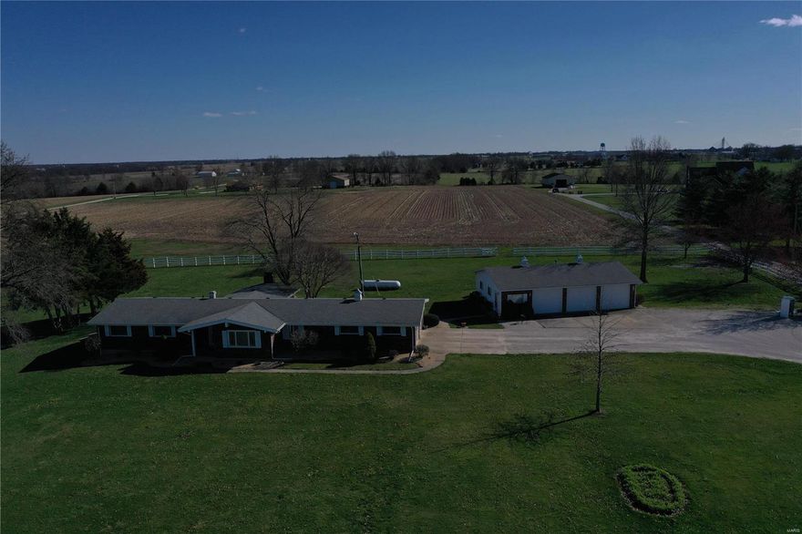 Perfect location.  Just on the edge of Montgomery City!!!!

Property has a 30x45 detached garage.  Currently approximately 60% of this garage is finished as office space.  Great place to work from home!   
Property includes 10 acres of land.  Approximately 5 acres of the land is currently productive tillable land.  If purchaser only wants 5 acres with the house the asking price is $309,000.

Property has a septic tank and has started process to add a new lagoon to get septic system up to state standards.