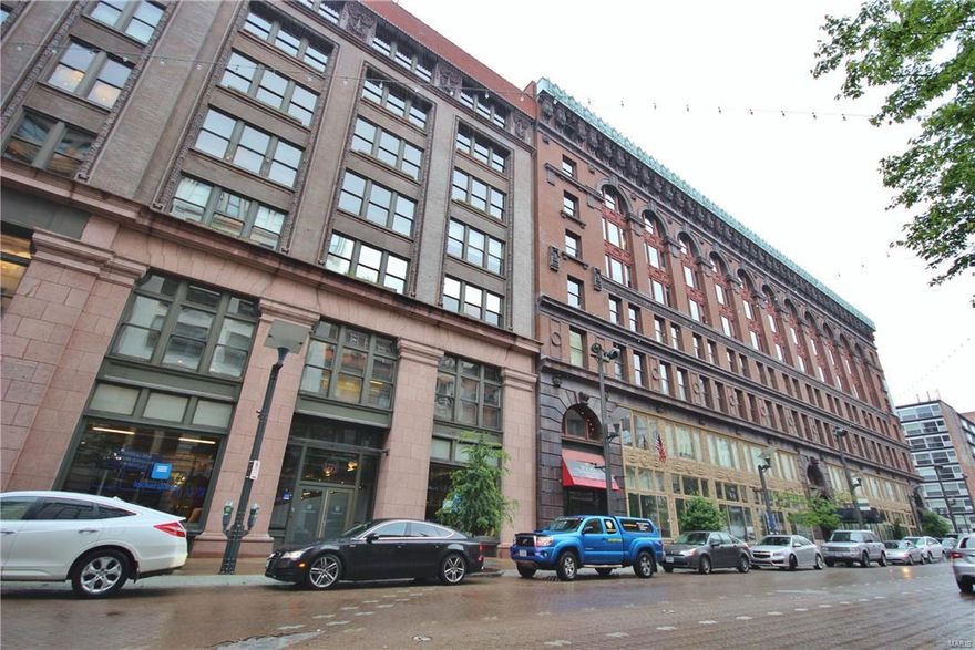 NEW PRICE! Enjoy the best of city living in this contemporary loft in a historic building! Enter to the lobby with soaring ceilings and an elevator that takes you right up to the unit. Upon entering, you'll notice the open layout, large windows, gleaming wood floors, exposed brick, and stunning chandelier! The living room flows into the dining room and breakfast bar. The kitchen will wow you with 42" custom cabinets with crown molding, granite counters, and stainless steel appliances including a wine cooler! You'll love the convenience of in-unit laundry! Down the wide hallway is the master bedroom with an expansive walk-in closet. The en-suite bathroom is a retreat with a tile-surround step-in shower and lovely stone accents. French doors off the living room lead to the spacious second bedroom and another full bathroom. Residents enjoy access to the rooftop deck! Don't miss out on this great opportunity! Location: City, Downtown, Retail Center, Upper Level