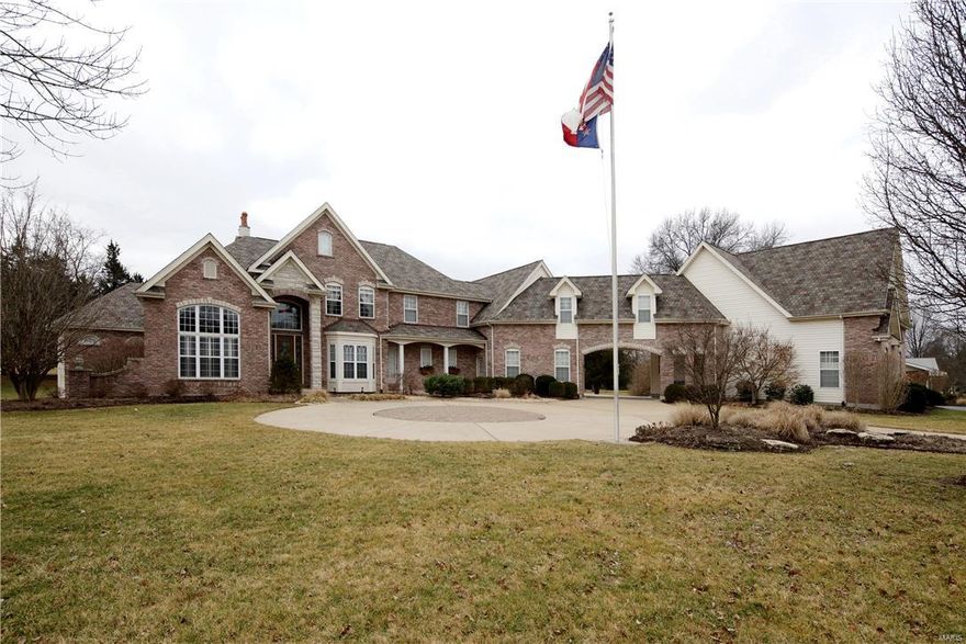 This custom 1.5sty w/attached guest house is truly magnificient! Stately circle drive, porte cochere,lush landscaping & brk ext enhances the elevation. 2 sty foyer is flanked by den/library & formal Dining room. 2sty Great room has a FP w/marble surround & carved wood mantle, 2sty wall of windows & leads to patio overlooking a level oasis w/FP & inground pool & gazebo. Kitchen has slate floors, 42’’custom cabs w/crown atop, center island, solid surface counters,stone/backsplash & top of the line appl. Breakfast room has 2 level breakfast bar.Hearth room has a beautiful FP & lovely windows. Main flr master has w/o to covered porch & a lux bath w/tumbled French marble,dual vanities w/intricate detail, granite,tub, sep shower & WIC. 2nd bedroom is also on MF. UL has 3 addl beds, Media & Rec room. Guest House has 2bed 2bath, kitchen, LR/DR combo & laundry. Exquisite features: custom millwork,crown,plantation shutters,custom shades,wide plank hickory hardwood,extra wide baseboards & MORE!